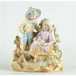 BISQUE FIGURINE OF BOY, GIRL AND RABBITS