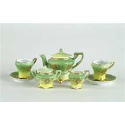 SEVEN PIECE HAND PAINTED DOLLS TEA SET