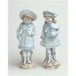 PAIR OF BISQUE DECORATED FIGURINES