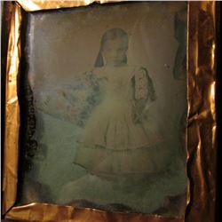 Civil War era embossed leather and wood case with a tin-type of a young girl with a flower bouquet, 