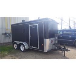 Tandem axle Flaman Trailer with ramp door. Comes with wall hung Propane Heater and Mount Sopris winc