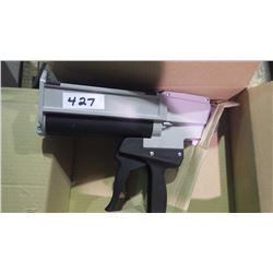 New unused Two compartment adhesive gun