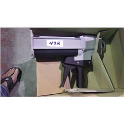 New unused Two compartment adhesive gun