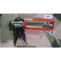 Two unused caulking guns
