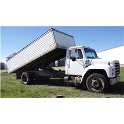 1985 IH 2-ton, 6.9L diesel, 5/2 spd., 2-way hoist, duals, 18' box, steel floor, drill fill