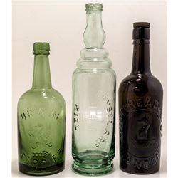 Three Foreign Pictorial Bottles