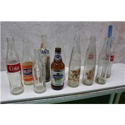 Lot of Assorted Glass Bottles (12)(Coke, Fanta, Labatt’s Lite, Dad’s Orange Soda Etc; )