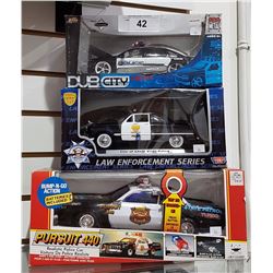 THREE COLLECTIBLE DIE CAST CARS
