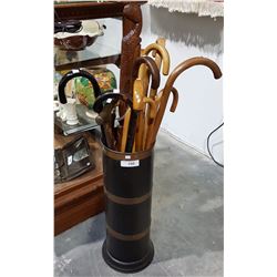 COLLECTION OF WALKING CANES IN STAND