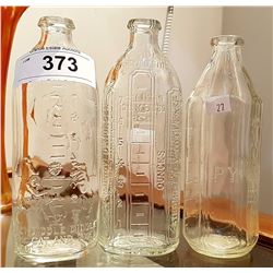 THREE GLASS BABY BOTTLES