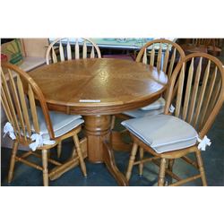 ROUND OAK TABLE WITH LEAF AND FOUR PRESSBACK CHAIRS