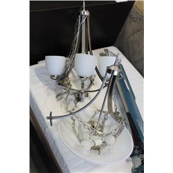 TWO MODERN STAINLESS AND GLASS CHANDELIERS