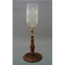 A Regency mahogany table lamp having lancet and figural acid-etched shade with brass sconce raise...