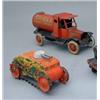 Image 1 : A tin-plate clockwork model of a petrol tanker, "Shell Motor Spirit" with red livery and stylised...