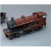 Image 1 : A "Bassett-Lowke" style clockwork tin plate locomotive in maroon livery, L 9.5ins; together with...