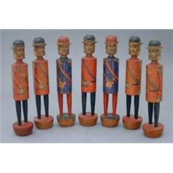A set of seven Austrian painted wood skittles, circa 1890, modelled as soldiers in red and blue t...