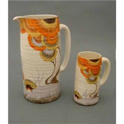A Clarice Cliff 'Rodanth' pattern large lemonade jug, with banded exterior, painted in colours, p...