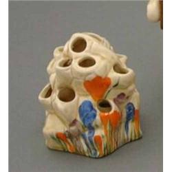 A Clarice Cliff 'Crocus' pattern posy vase, modelled as a rockery, H 4ins....