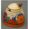 Image 1 : A Clarice Cliff 'Gayday' pattern honey pot and cover, painted in colours, H 3.5ins....