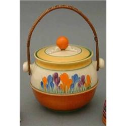 A Clarice Cliff 'Crocus' pattern biscuit barrel and cover, of circular shape, with flattened circ...