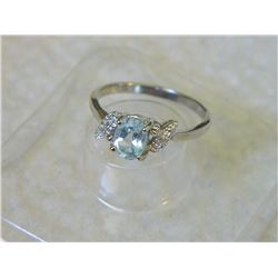 RING - OVAL FACETED LIVELY SKY BLUE TOPAZ & 2 DIAMONDS IN STERLING SILVER SOLITAIRE DESIGNED SETTING