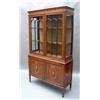 Image 1 : A Sheraton revival mahogany display cabinet having dentil cornice above two arched bar-glazed doo...