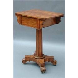 A William IV rosewood work table with shaped rectangular top, fitted two drawers raised on octago...