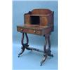 Image 1 : A Regency mahogany bonheur du jour, the superstructure with open recess, flanked by two doors, ov...