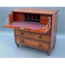 A Regency mahogany chest, ebony line-inlaid and fitted secretaire drawer with fitted interior, ab...