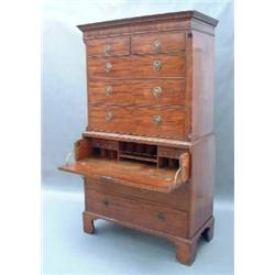 A George III mahogany chest on chest, having dentil-moulded cornice, the upper section fitted two...