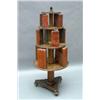 Image 1 : A Regency painted revolving bookcase, having three circular graduated tiers, each interspaced by...