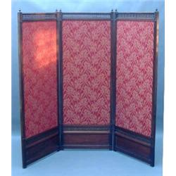 A Victorian mahogany three-fold draught screen, the reeded frames surmounted by pierced fret pane...