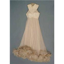 A cream silk satin crepe evening gown, having sleeveless bodice and peach silk chiffon over-skirt...