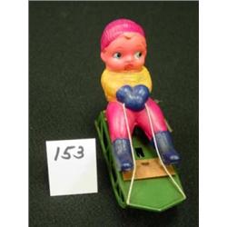 WIND-UP Celluloid Child in Sled - OJ
