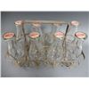 Image 1 : 8 MILK QT. CARRIER WITH CAPPED BOTTLES ST. EUSTACHE P.Q. CAPS LOCATION: LOWER LEFT