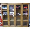 Image 1 : 4 SHELF WOODEN CABINET GLASS DOORS- 57 1/2" X 14" X 51" CONTENTS NOT INCLUDED LOCATION: LOWER RIGHT