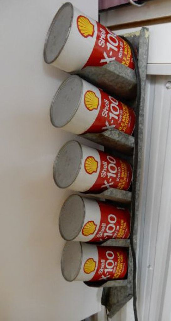 Shell Oil Can Rack 5 OIL CAN DRAIN RACK WITH 5 SHELL X-100 FIBRE CANS LOCATION: LOWER LEFT