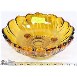 LARGE AMBER GLASS FOOTED BOWL.  11" DIAMETER.