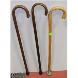 THREE ASSORTED WOOD WALKING CANES