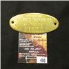 Image 1 : 400.Brass oval-shaped box tag "Property of The Rath Packing Co. Waterloo, Iowa 11573".