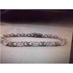 BRACELET - 6.84 CTW (12) OVAL FACETED WHITE TOPAZ & ROUND FACETED DIAMOND IN STERLING SILVER INFINIT