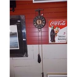 FOLK ART WALL CLOCK WITH CAST IRON WEIGHTS