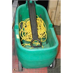 GREEN PLASTIC WAGON SOLD WITH LARGE EXTENSION CORD