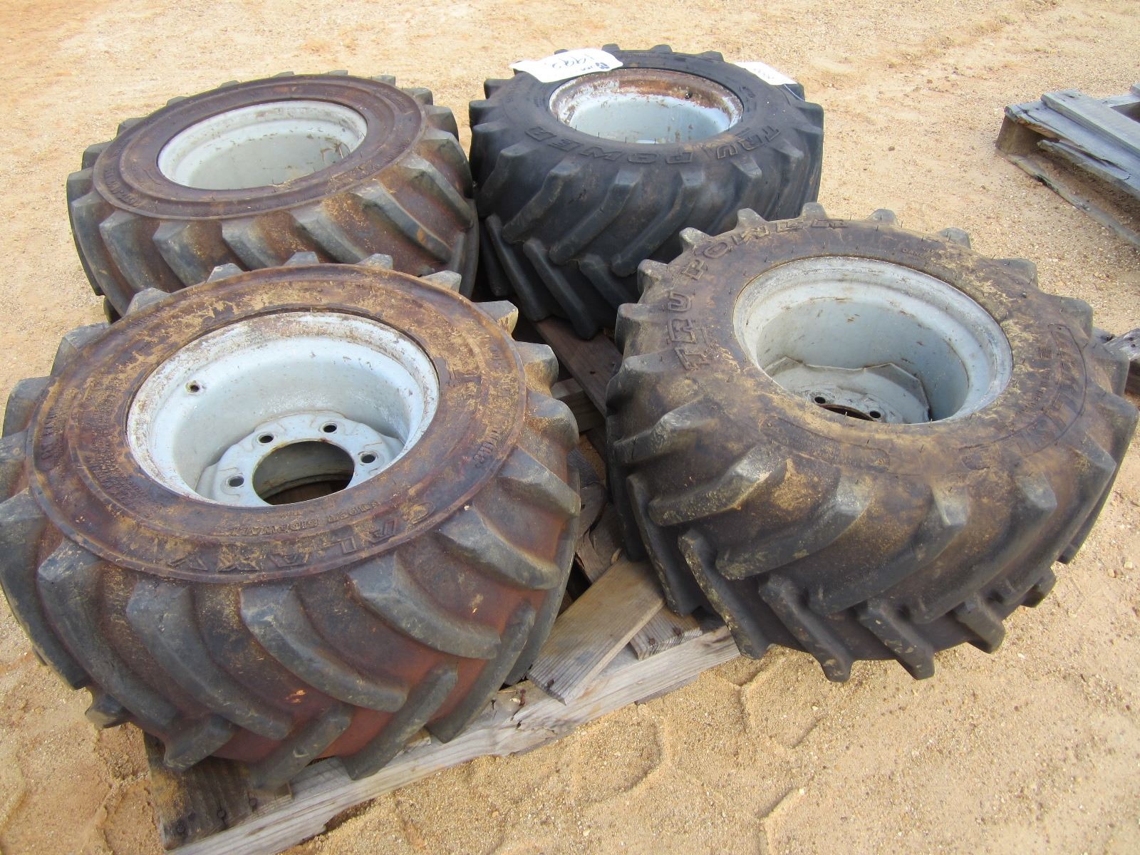 (4) 26X12.0012 NHS FOAM FILL TIRES & RIMS