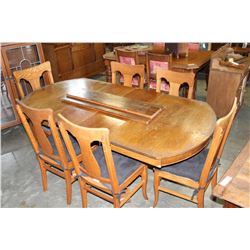 ANTIQUE TIGER OAK DINING TABLE WITH FOUR LEAFS AND SIX T-BACK CHAIRS