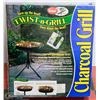 Image 1 : NEW TWIST-N-GRILL CHARCOAL GRILL W/ STAND
