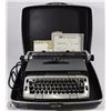 Image 1 : SMITH CORONA TYPE WRITER IN CASE AND WITH MANUAL