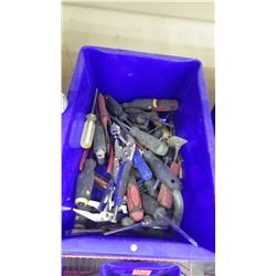 Tub with assorted screw drivers and vice grips