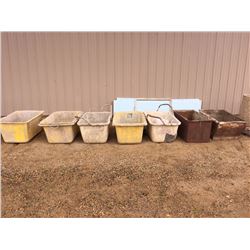 Seven used plastic and metal mortar tubs and two exposed aggregate concrete ash trays
