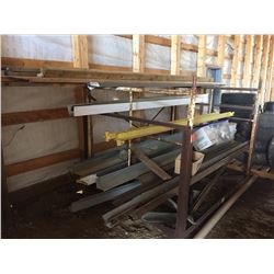 metal rack with assorted angle iron and flashings, and two wooden cabinets
